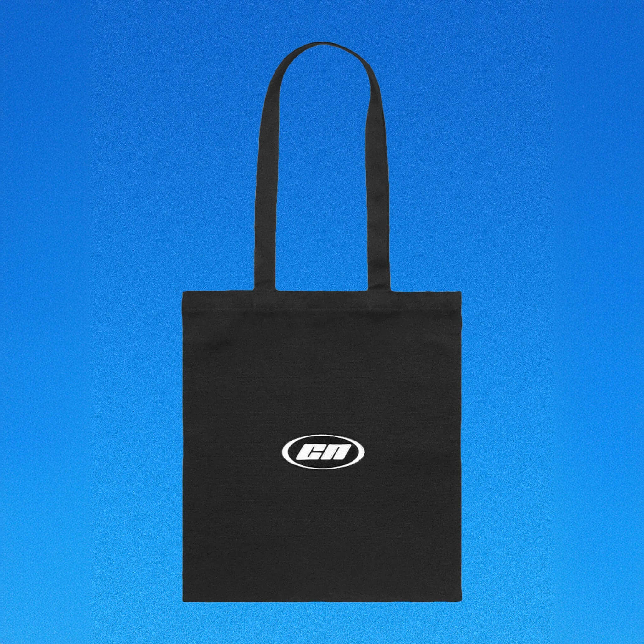 Black tote bag with a logo on a blue background