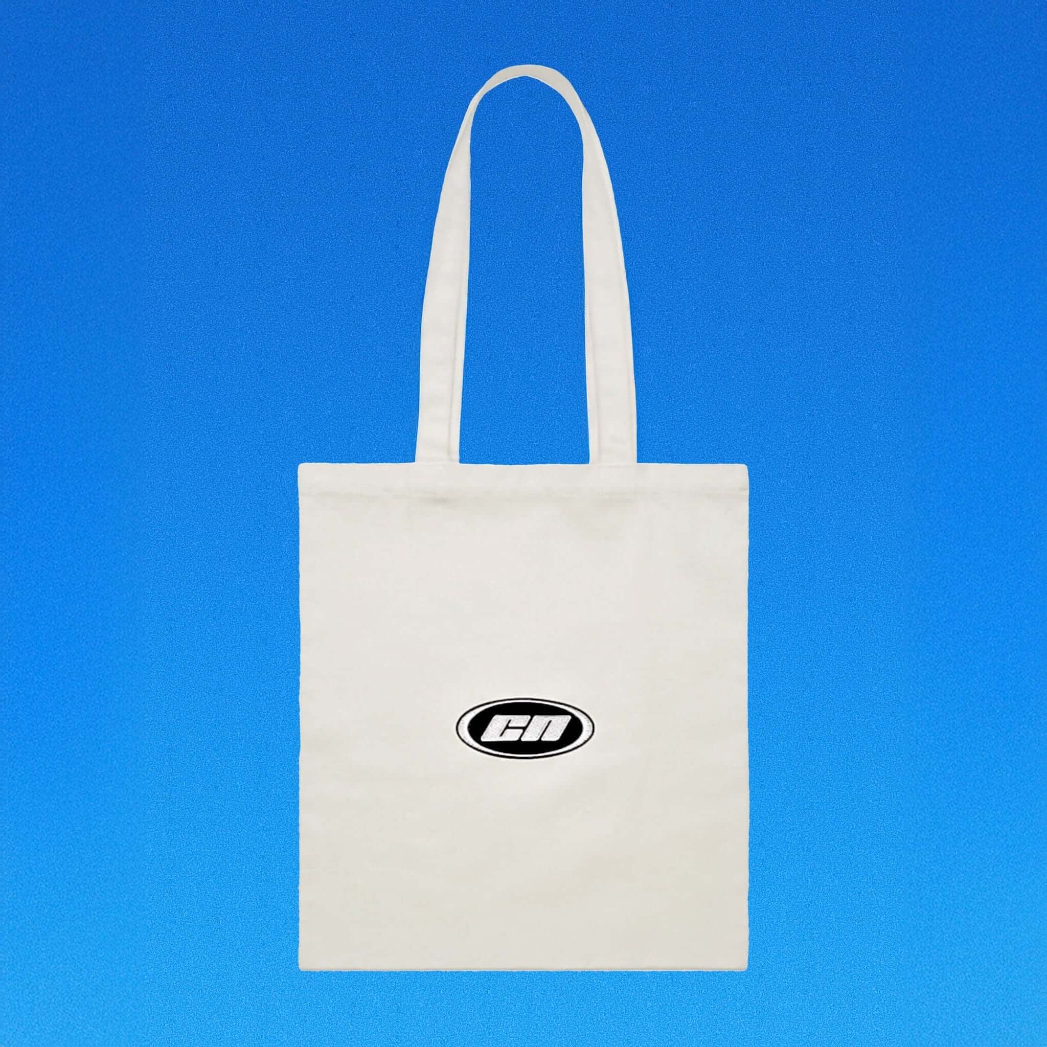 White tote bag with a logo on a blue background