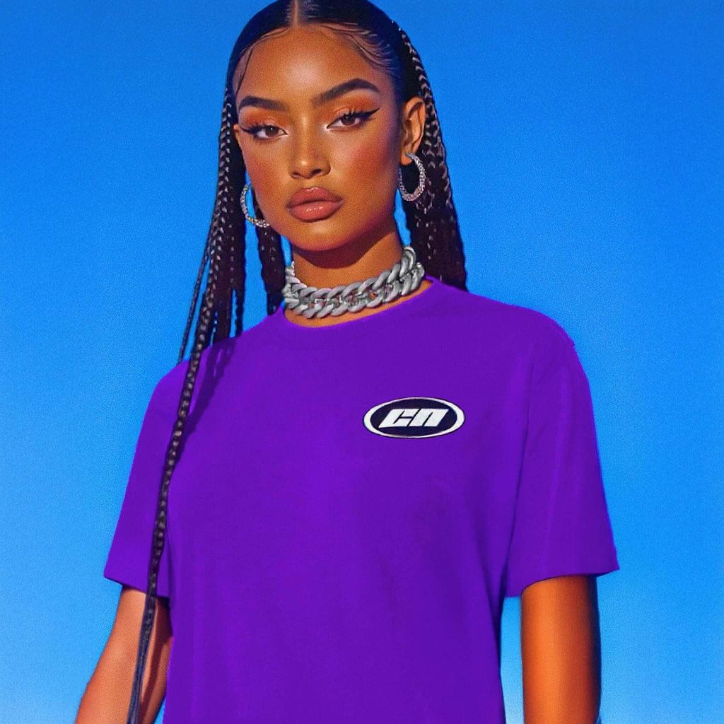 Woman wearing a purple t-shirt with a logo against a blue background