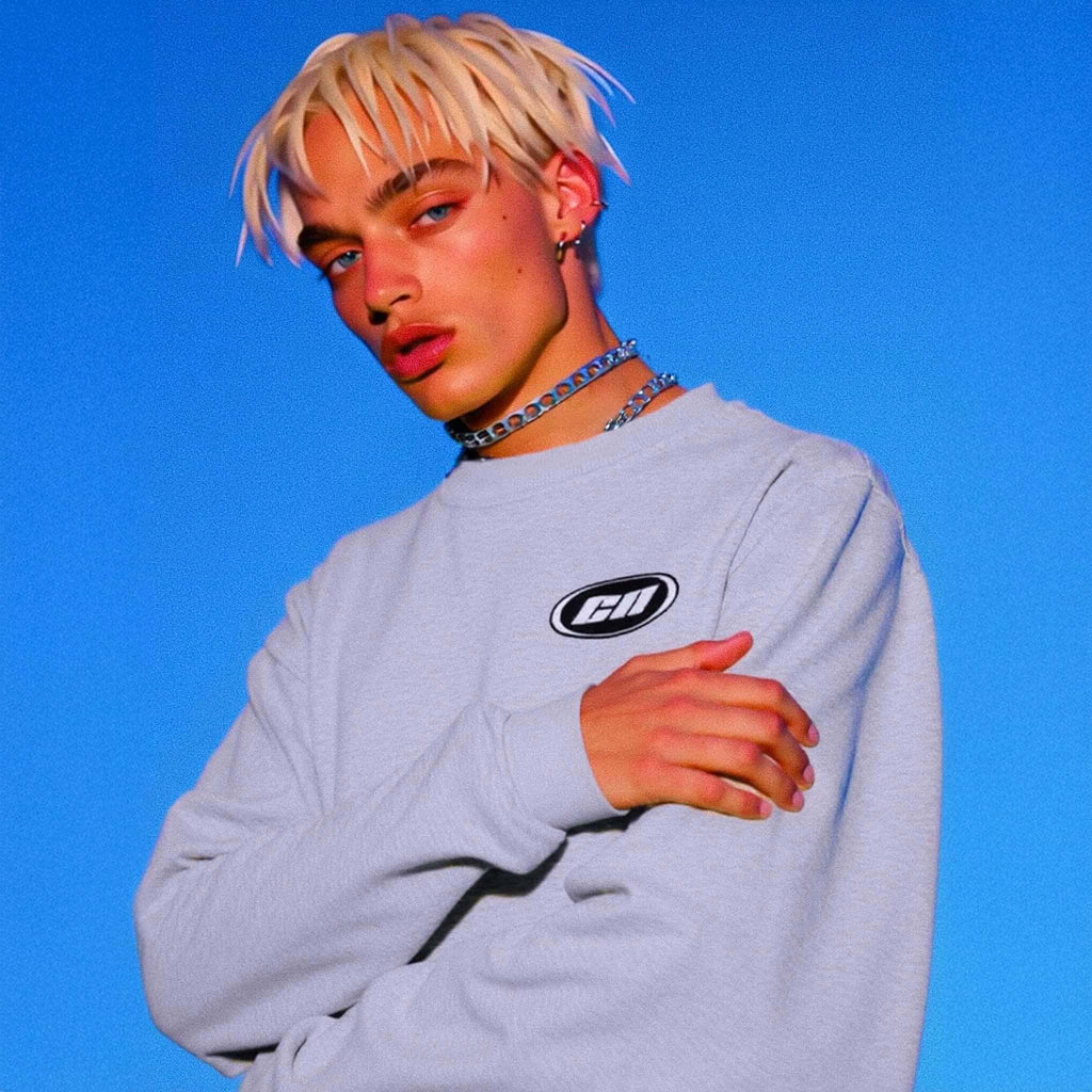 Person wearing a light gray sweatshirt with a logo on a blue background